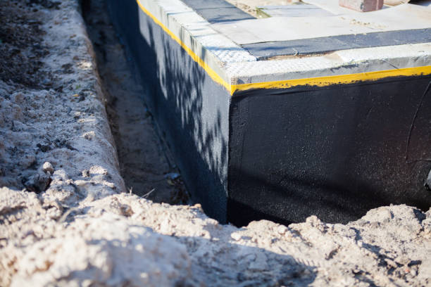 Professional Basement Waterproofing technician working in Glenford, OH